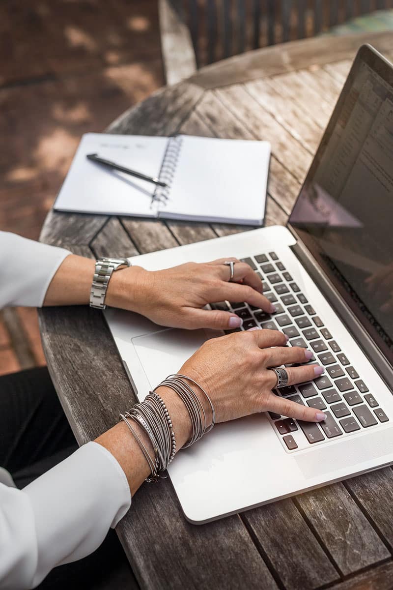 Woman-hands-on-laptop 