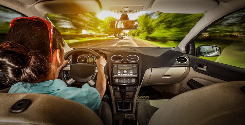 Lady driving car at high speed blur